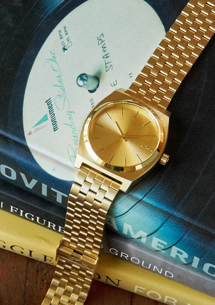 
                      
                        NIXON TIME TELLER GOLD
                      
                    